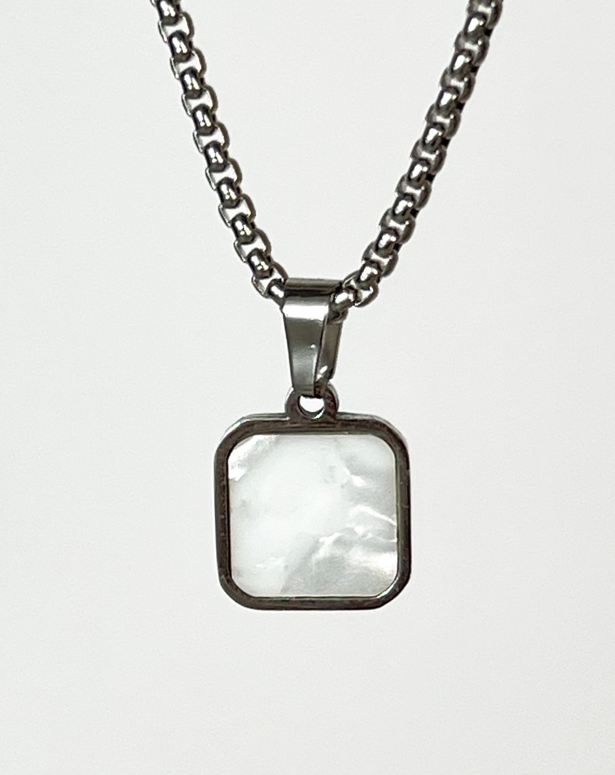 DUAL-SIDED PENDANT