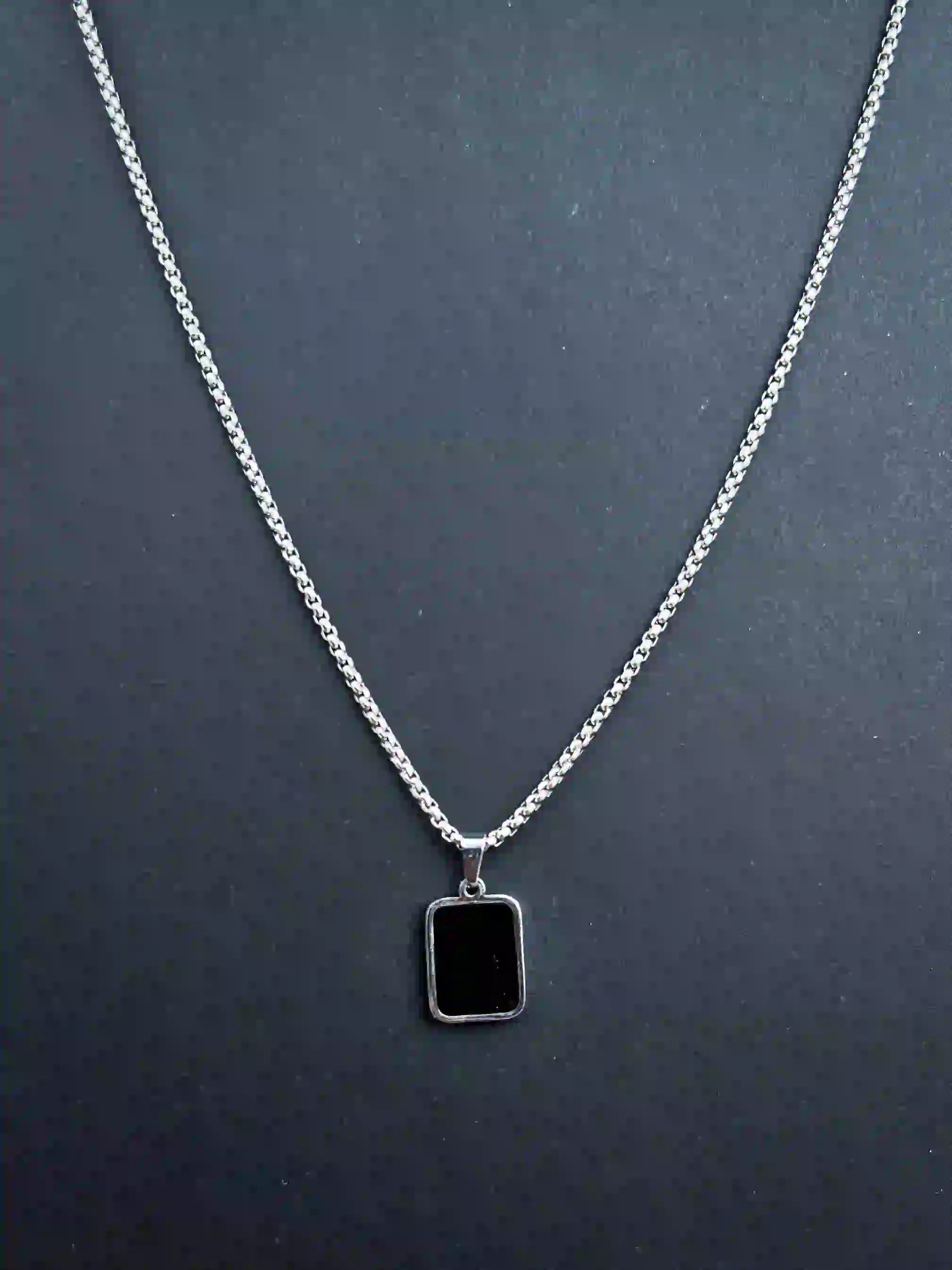 DUAL-SIDED PENDANT