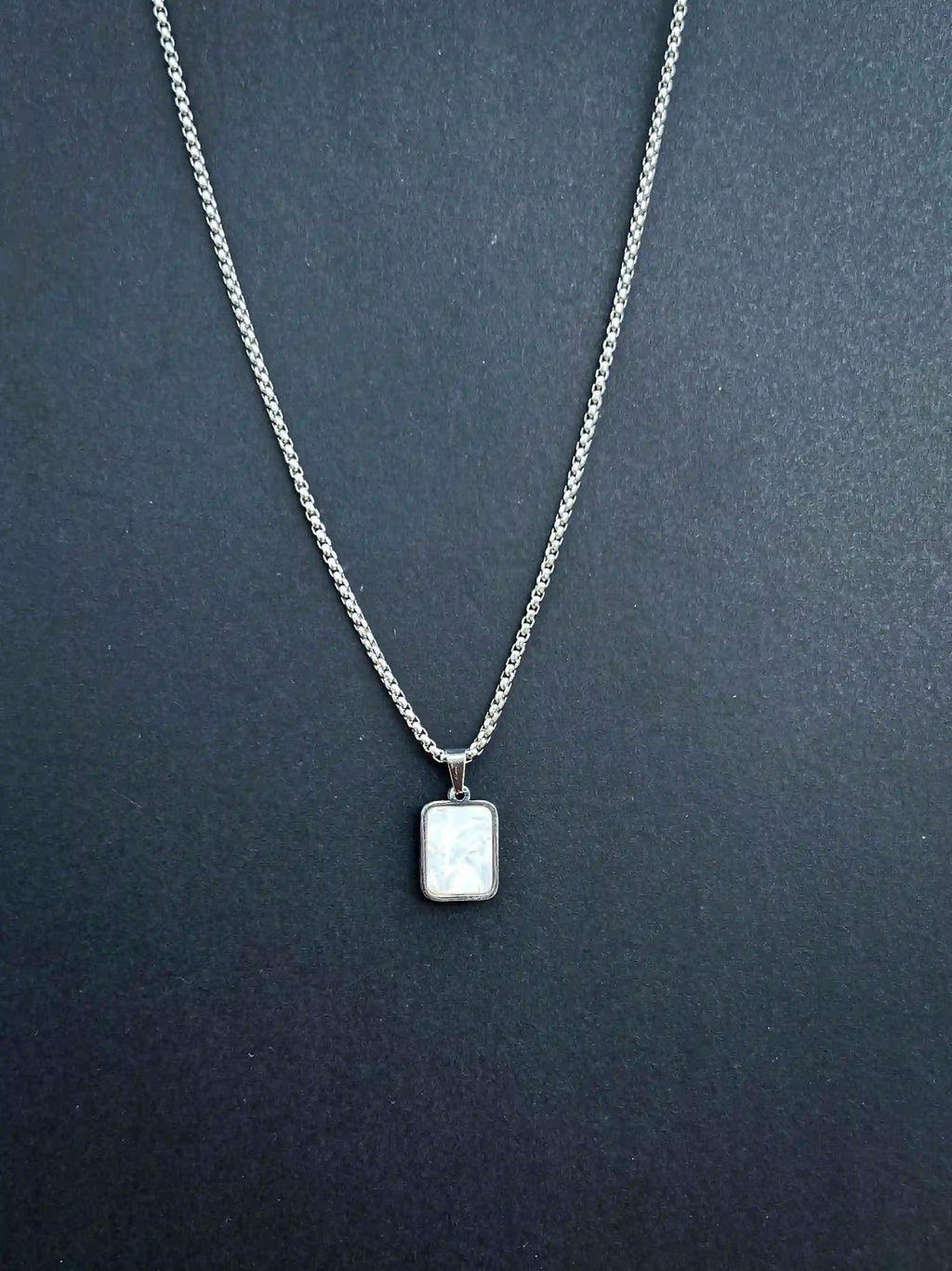 DUAL-SIDED PENDANT