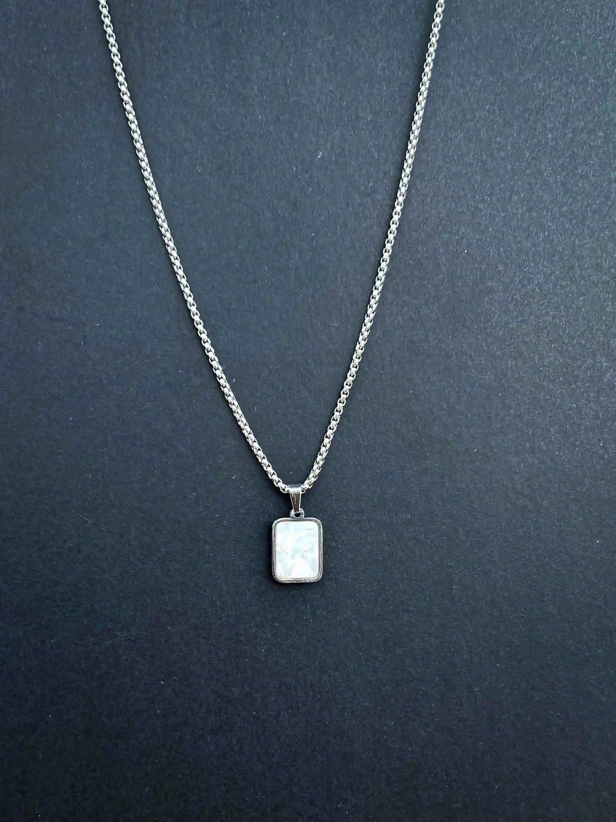 DUAL-SIDED PENDANT