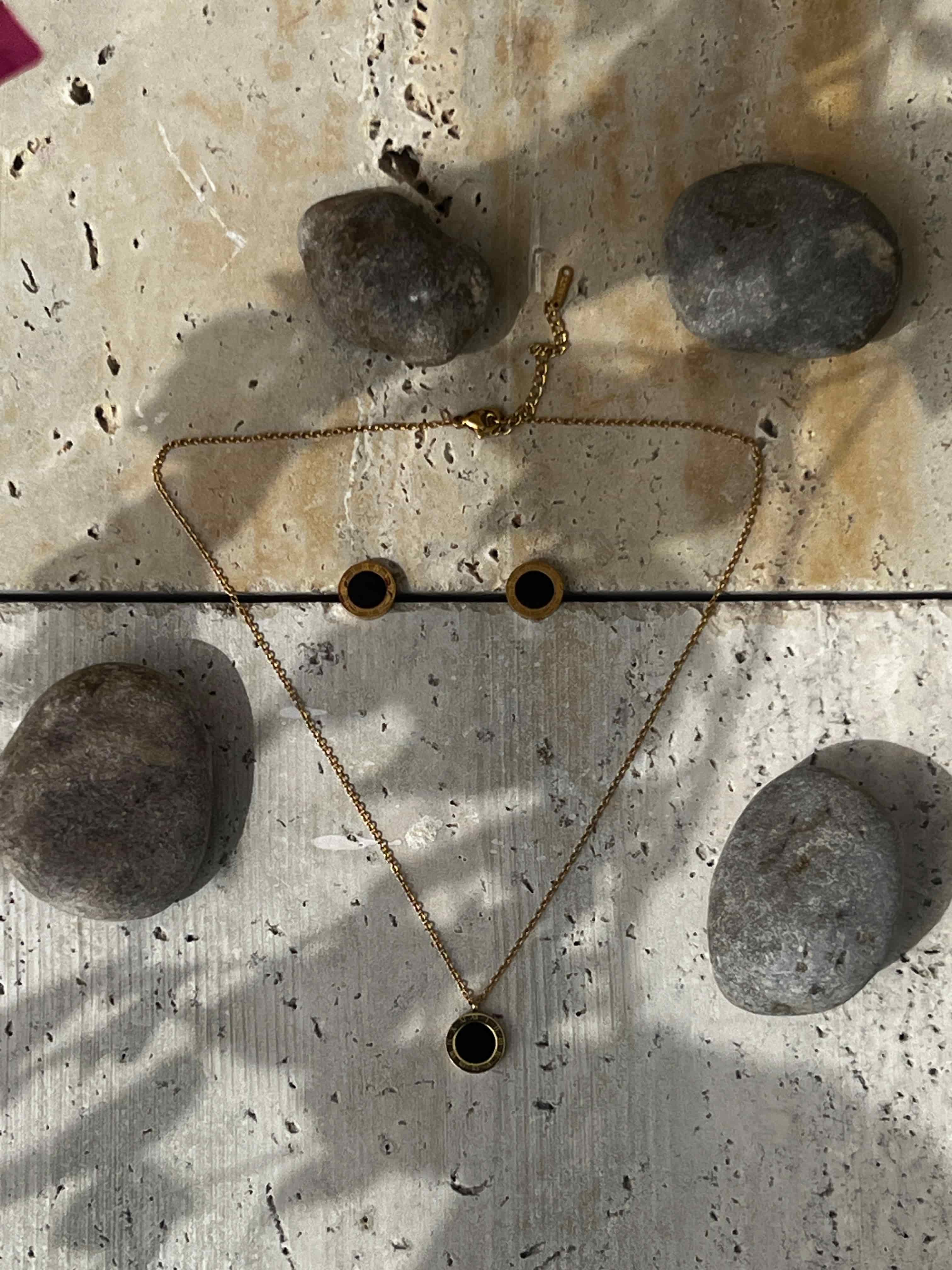 Elegant jewelry for everyday wear featuring a minimalist gold and black necklace with a black enamel pendant — modern jewelry set for women’s fashion accessories.