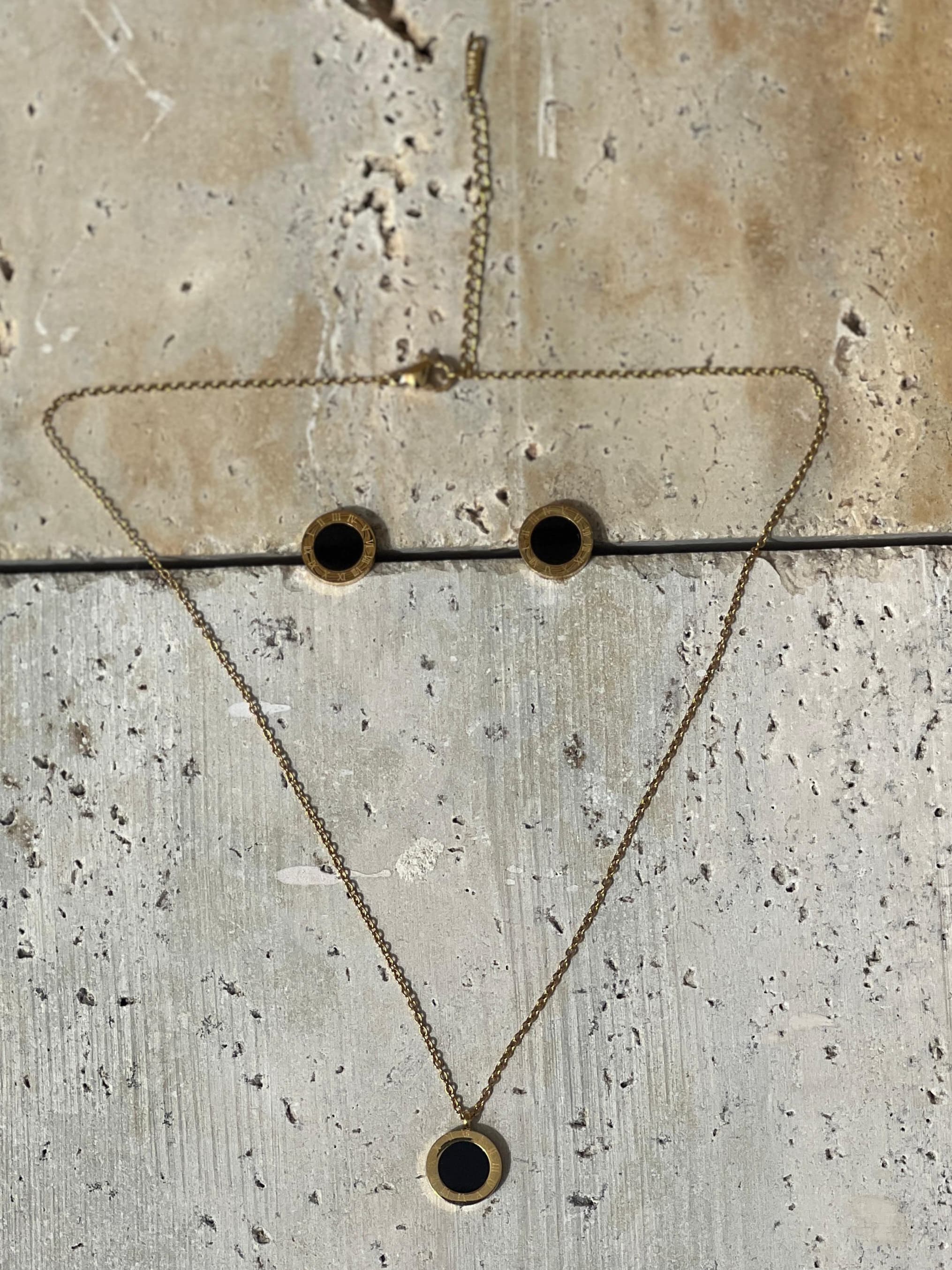Elegant jewelry for everyday wear featuring a minimalist gold and black necklace with a black enamel pendant — modern jewelry set for women’s fashion accessories.
